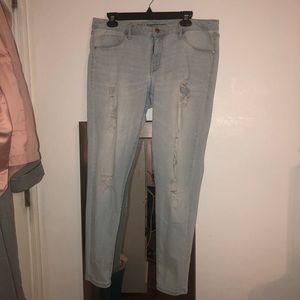 Mid rise stretchy distressed denim jeans